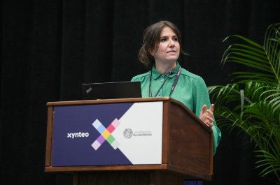 Female event speaker standing at a podium